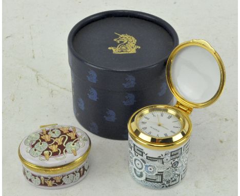 An Alastor enamels miniature clock, in original box, together with a lidded pot by Crummles
