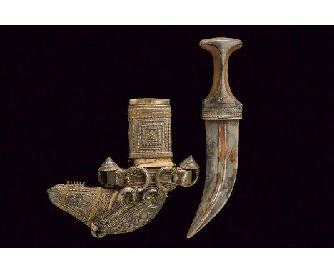 dating: circa 1900 provenance: Oman, Curved, double-edged blade with central raiser. Horn grip, with silver mounts. Wooden, f