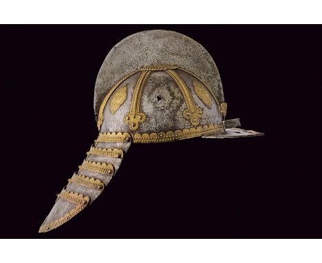 dating: 17th Century provenance: Poland, Iron skull, in two pieces, with high comb, pointed brim, pierced in the center for n