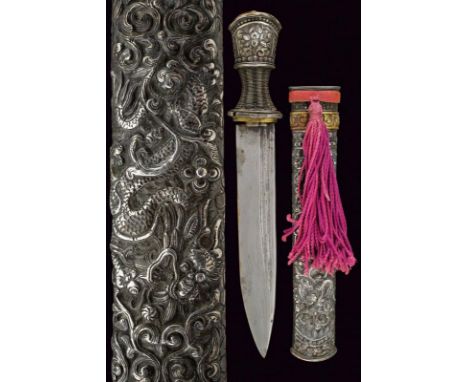 dating: 19th Century provenance: Bhutan or Tibet, Straight, single-edged blade with double groove. Silver hilt embossed with 