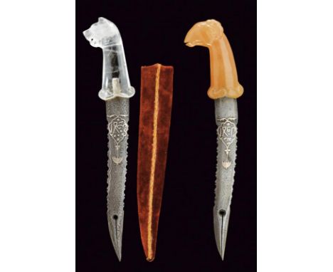 dating: 20th Century provenance: India, Curved, dented blade with double tip; one with crystal grip and the other with orange