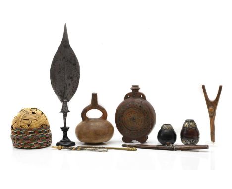 Two Argentinian mounted mate gourds and bombillas,  20th century, 7.5cm and 9cm high,  a wood-mounted dagger and sheath, 30cm