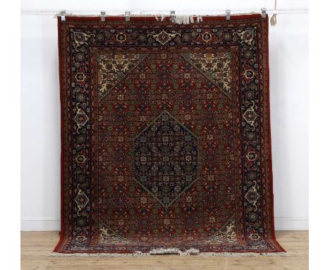 A modern Kashmiri red ground rug North West Persian pattern,243 x 178cmCondition ReportThe condition is considered to be good