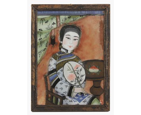 A Chinese reverse glass painting, Republic period (1912-1949), of a lady wearing a blue silk robe decorated with bamboo, hold