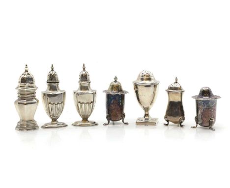 A group of silver pepperettes, comprising a pair of Edwardian urn-formed pepperettes by Robert Pringle &amp; Sons, Birmingham