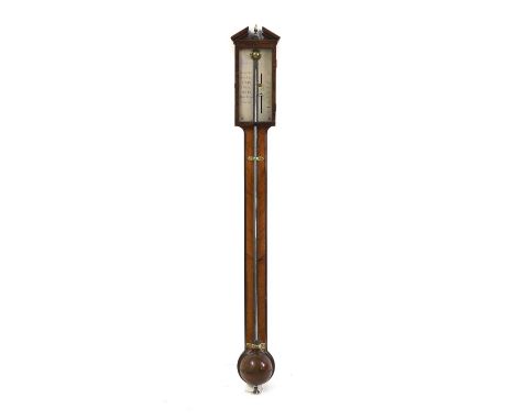 A George III mahogany stick barometer by Gilbert Wright &amp; Hooke, London, with breakfront pediment above a silvered dial a