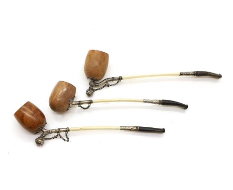 A group of three silver mounted albatross quill pipes, 19th century, French, each with a burr yew bowl, two marked 'Depose',1