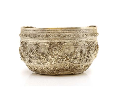 A Burmese silver bowl,  late 19th century, embossed and chased with a band of figures, tests silver, unmarked, 15.5cm high, 2