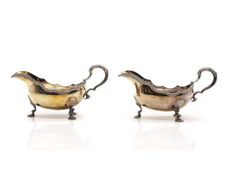 A pair of George II-style silver sauce boats, A Chick &amp; Sons Ltd, London 1973, each with a C-scroll handle and pad feet, 