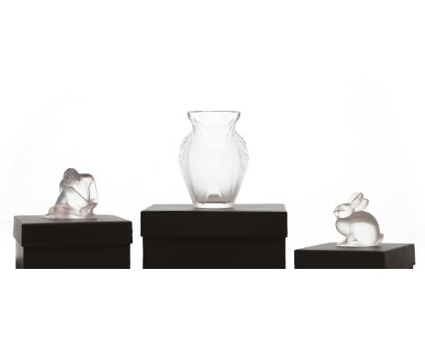 A group of three Lalique glass items comprising 'Lapin Assis', 6.7cm high, a 'Pavie' vase, 12.5cm high, and 'Statuette Nu Rev