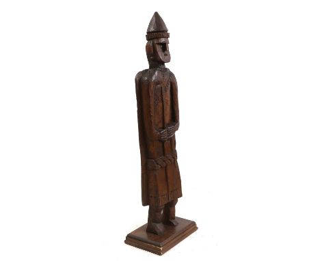 A carved wood figure, 20th century, modelled holding a spear on a wood stand, 134cm highCondition ReportWith knocks and wear.