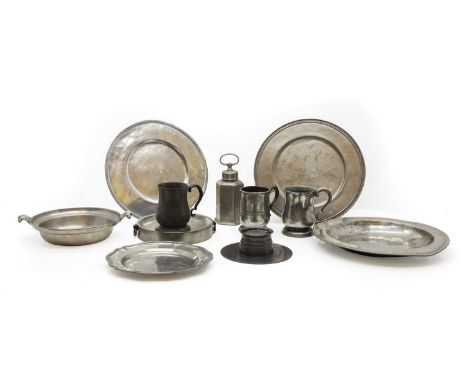 A collection of pewter,  18th century and later, comprising dishes, tankards, one engraved 'Prince of Wales Bungay', a warmin