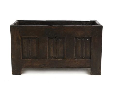 An oak three panelled linen fold carved log box, 17th century with later alterations, converted from a coffer108cm wide56cm d