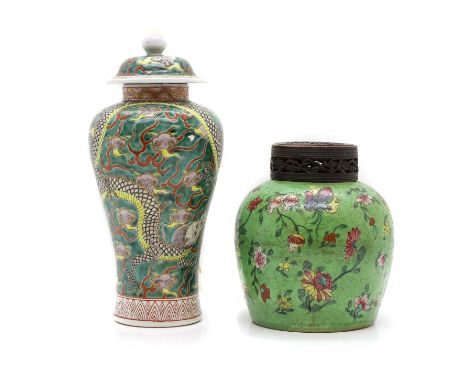 A Chinese famille rose jar and cover, Guangxu (1875-1908), of ovoid form, painted with lotus, peaches, butterflies and other 