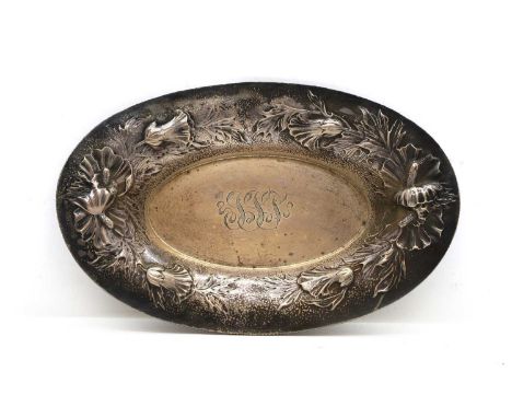 An American silver oval bowl,  early 20th century, makers mark for Theodore Starr, New York, embossed and chased with a garla