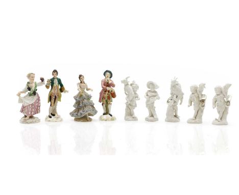 A group of nine porcelain figures comprising five blanc de chine Berlin figures, each with an underglaze painted mark, two Dr