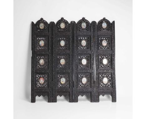 An Anglo-Indian carved hardwood table screen, 19th century, comprising four panels, each inlaid with four ivory portrait mini