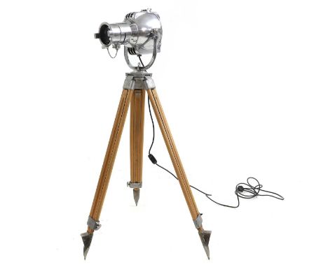 A Strand Electric theatre light 20th century, raised on an adjustable tripod, stamped 'Strand Electric',134cm highCondition R