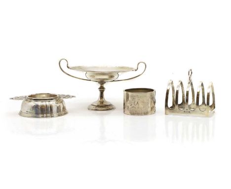 A collection of silver items, comprising a twin-handled pedestal dish, London 1905, 9.5cm high, a tea strainer, Birmingham 19