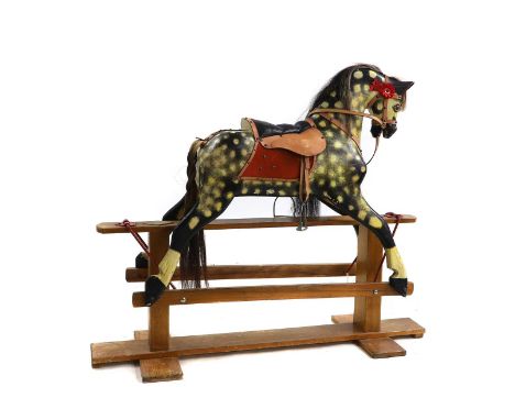 A Stevenson Brothers rocking horse, 20th century, a dappled grey, with harness and saddle, with rosettes 'Stevenson Brothers 