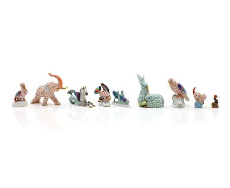 A group of Herend porcelain animals comprising an elephant, 13cm long, two rabbits, 8.8cm high, a parakeet, 8cm high, a winge