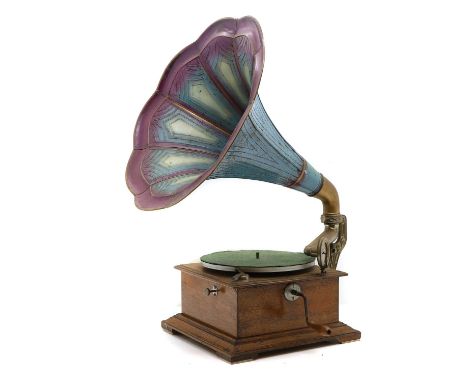 A tabletop oak cased gramophone, early 20th century, complete with painted tin horn,68cm highCondition ReportMechanism appear