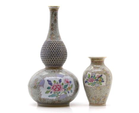 Two Herend porcelain vases 20th century, printed marks, comprising a reticulated example,of double gourd form, with painted f