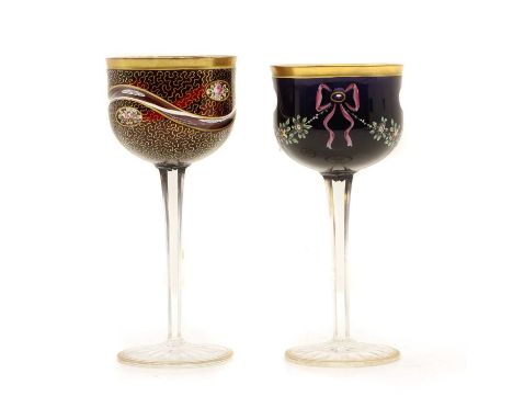 Two wine glasses, one Moser, in cranberry and ameythst, flash cut, vermiculated, and each with enamelled flowers panels and s