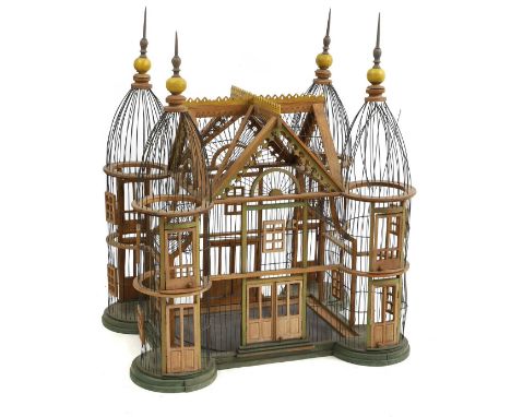 An architectural bird cage 20th century, modelled in the form of a European chateau, 76cm wide64cm deep89cm highCondition Rep