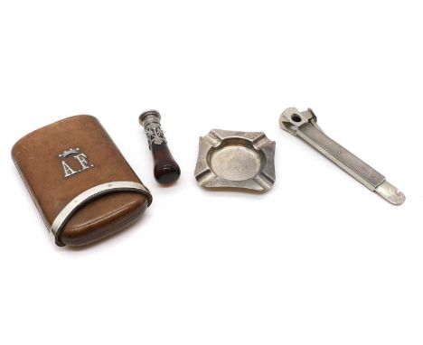 A silver mounted leather cigar sleeve, mounted with initials 'AF' below a coronet, 14.5cm, a silver mounted cigar cutter, 14.