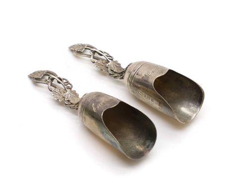 A matched pair of silver caddy spoons,  engraved 'Earl Grey' and 'Ceylon Tea' with handles formed as vine leaves, 10.1cm high