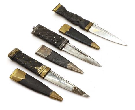 Three Scottish sgian dubh,  one with Sterling silver mounts, Scott Adie Ltd, with an ebonised handle, the others with brass m