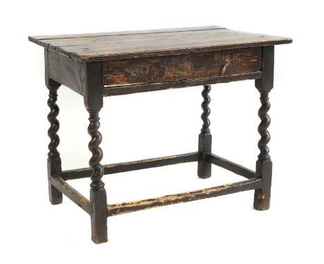 An oak side table, 17th century, the rectangular top above frieze drawer on stretchered barley twist supports 88cm wide 57cm 