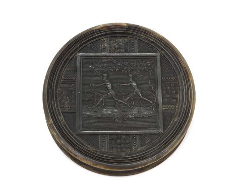 An early cycling pressed horn snuff box c.1820, of circular form, the cover decorated with a scene of two gentlemen on hobby 