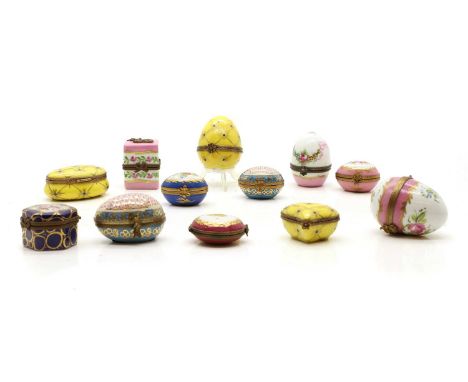 A group of Limoges porcelain and enamel pill boxes, to include six egg form examples, and three of the same colourway, all wi