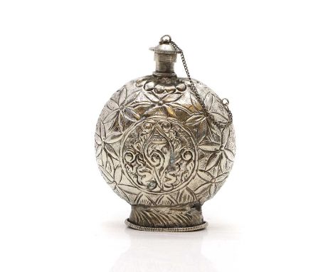 A white metal pilgrim flask possibly Chinese, with embossed foliate decoration,15cm highCondition ReportDoes not test as silv