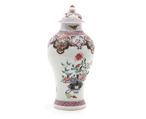 A Chinese famille rose vase with cover, 20th century, of baluster form, painted with a basket of flowers with precious object