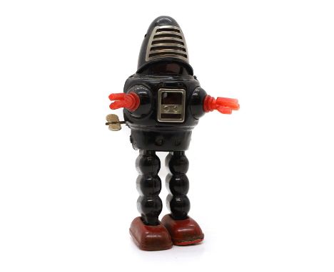 A tinplate Forbidden Planet Robby the Robot mechanical toy c.1960, Japanese, with a vented visor, 21.7cm highCondition Report