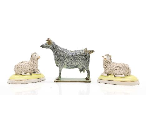 A Pearlware cow creamer, early 19th century, with a sponged body on a green plinth, restored,  17.5cm wide, and a pair of Sta