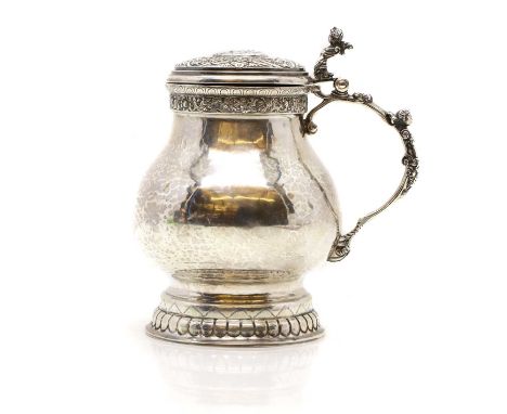 A German silver tankard, early 20th century, pseudo-Hanau marks,13cm wide18cm deep19cm high25oztCondition ReportFair conditio