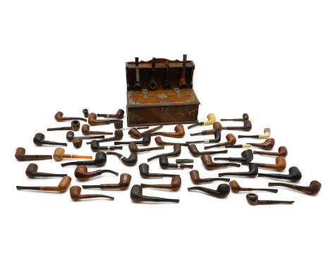 An oak pipe stand and compendium, 30cm wide 19cm deep23cm high, together with a collection of pipes, (qty)Condition ReportUse