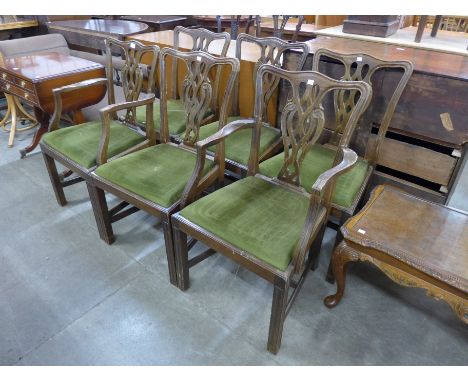A set of six Chippendale Revival carved mahogany dining chairs 