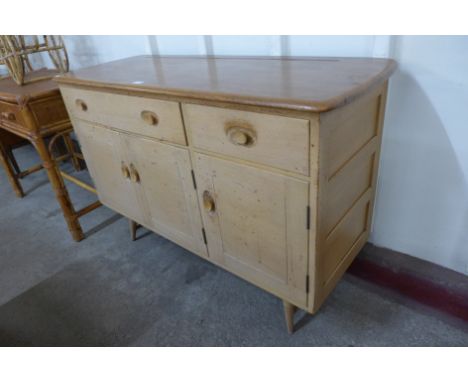 An Ercol Blonde elm and beech Windsor sideboard 