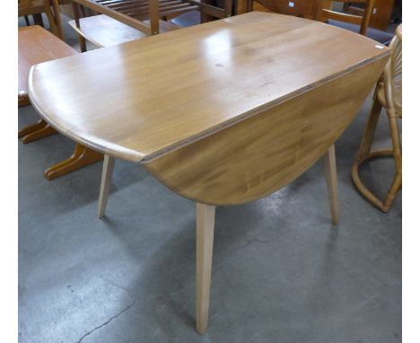 An Ercol Blonde elm and beech Windsor drop-leaf table 