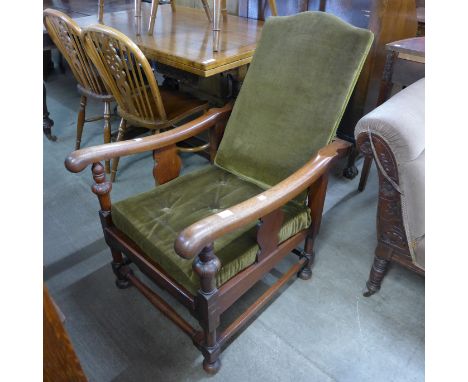 An Art Deco oak reclining fireside armchair 