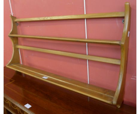 An Ercol Blonde beech plate rack 