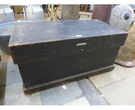 A stained pine tool chest with tools 