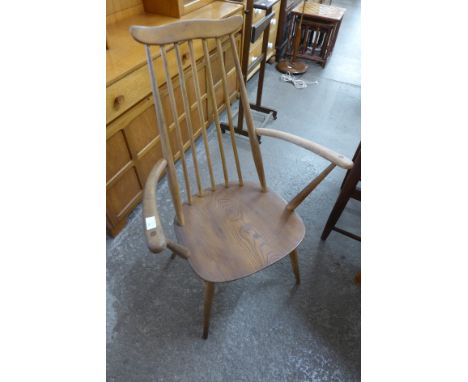 An Ercol Golden Dawn elm and beech Goldsmith elbow chair 