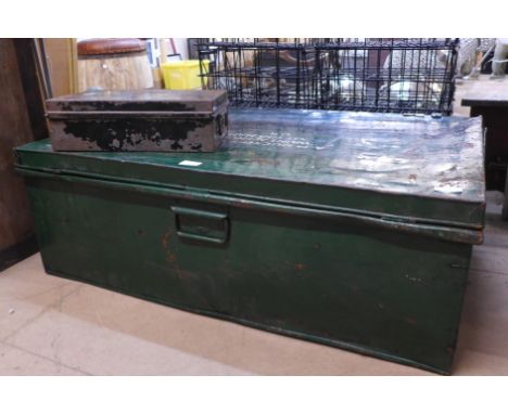 A large metal trunk, and a small metal box 