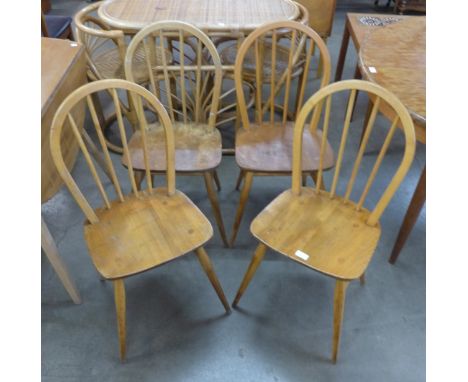 A set of four Ercol Blonde elm and beech Windsor chairs 